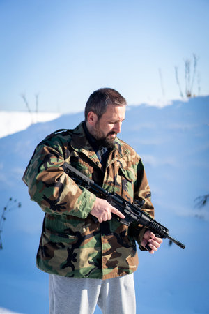 Male Soldier In Military Uniform On Winter Snow. High quality photo
