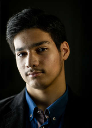 Portrait of real happy mixed race teenager smiling. High quality photoの写真素材