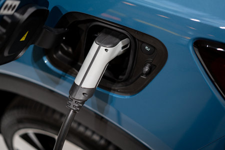 Power supply connect to electric vehicle for charge to the battery. . EV fuel Plug in hybrid car.の写真素材