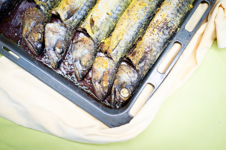 Preparing fresh nice fish in kitchen at homeの写真素材