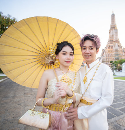 Portrait of thai couple in traditional wear at Wat Arun. High quality photoの写真素材