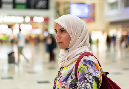 A Muslim is preparing for a vacation and she is at the airport. High quality photoの写真素材