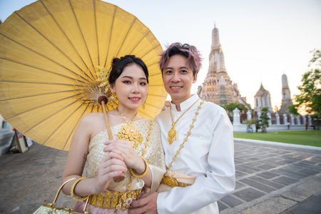 Portrait of thai couple in traditional wear at Wat Arun. High quality photoの写真素材