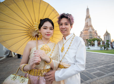 Portrait of thai couple in traditional wear at Wat Arun. High quality photoの写真素材