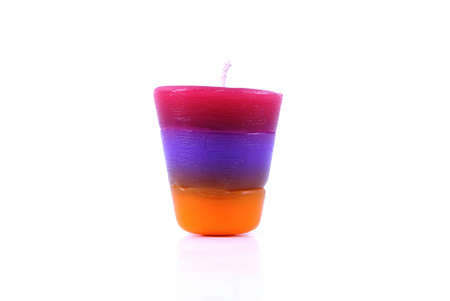 One colorful sweet candle on white backgroundの写真素材