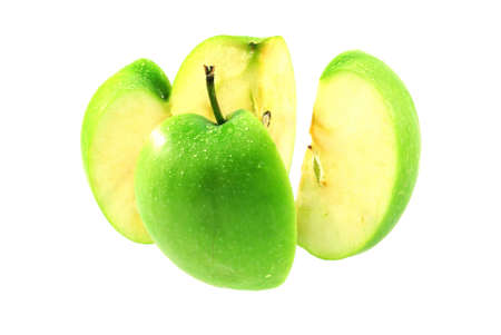 One green apple break on white backgroundの写真素材