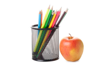 colour pencils in a black holder with appleの写真素材