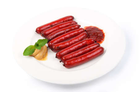 roasted sausages on porcelain plate の写真素材