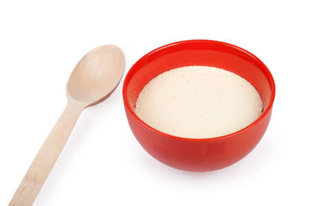 semolina in a plate isolated on whiteの写真素材