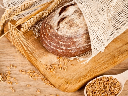 Fresh baked traditional bread and wheatの写真素材