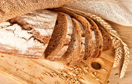 Fresh baked traditional bread and wheatの写真素材