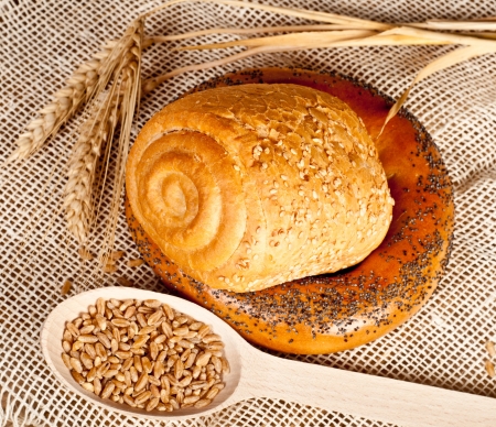 Fresh baked traditional bread and wheatの写真素材