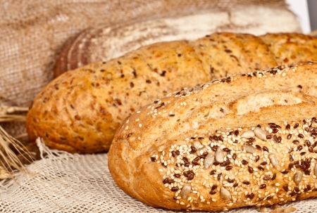 Fresh baked traditional bread and wheatの写真素材