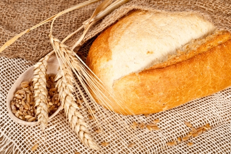 Fresh baked traditional bread and wheatの写真素材