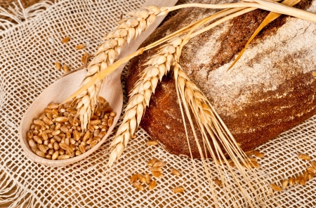Fresh baked traditional bread and wheatの写真素材