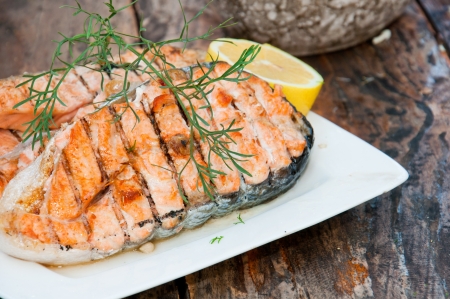 Salmon steak grilled with lemonの写真素材