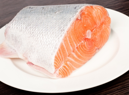 Fresh salmon red fish with lemon and spicesの写真素材