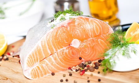 Fresh salmon red fish with lemon and spicesの写真素材