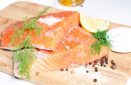 Fresh salmon red fish with lemon and spicesの写真素材