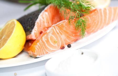 Fresh salmon red fish with lemon and spicesの写真素材