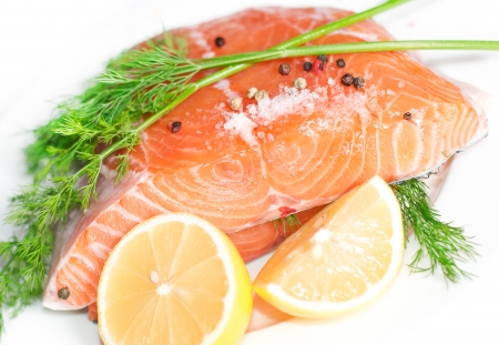 Fresh salmon red fish with lemon and spicesの写真素材