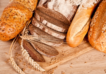Fresh baked traditional bread and wheatの写真素材