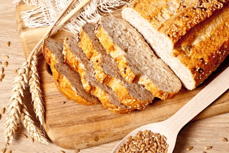 Fresh baked traditional bread and wheatの写真素材