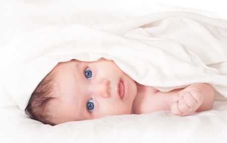 Cute blue-eyed newborn baby.の写真素材