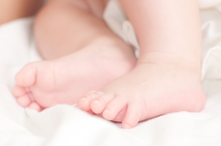 Sweet newborn baby feetの写真素材