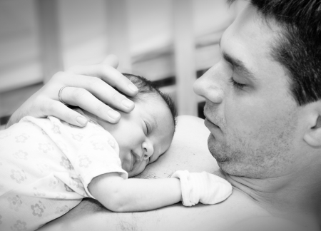 Cute  newborn baby with father  Can be used in journal or packaging or as postcard concept の写真素材