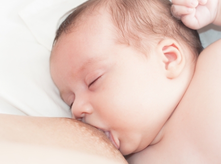 Breastfeeding of a newborn baby  Can be used in any breastfeeding article or product package の写真素材