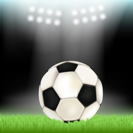 Soccer ball on stadium field grass, illuminated by floodlightsのイラスト素材