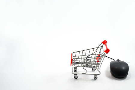 Online shopping, Black mouse in the shape of a shopping cartの写真素材