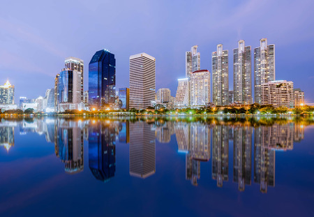 Panoramic night view of City reflect on waterの写真素材