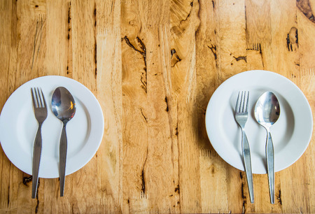 white plat on wooden tableの写真素材