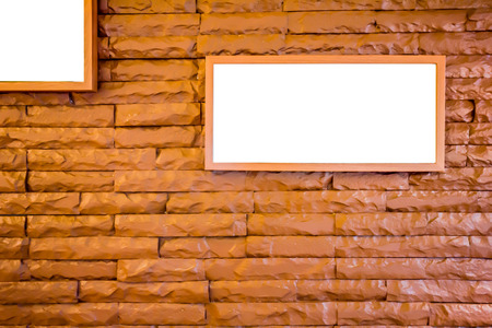 Picture frames on brick wallの写真素材