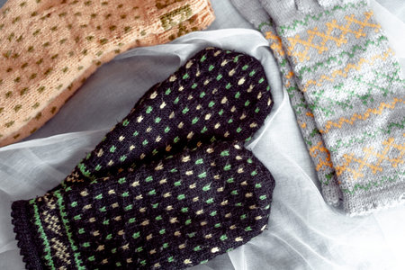 Knitted mittens and socks, preparing warm DIY clothes for winter