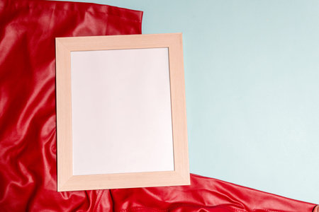 Canvas Image of a white blank canvas on top of a red cloth for mockup