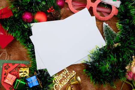 Rectangle christmas greeting cards mockup image. A blank white paper decorated with a lot of...