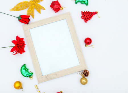 Blank white canvas mockup image with christmas decorations. A blank white canvas encircled by christmas ornaments, colorful gift decorations. Blank space to fill. Christmas canvas mockup imageの写真素材