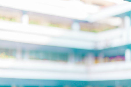 Defocused abstract background of a white tall building with few floors. Blurred out building area backgroundの写真素材