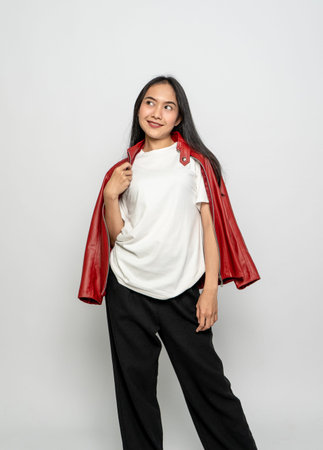 A young woman with a white blank shirt and leather red outer doing a pose with the white background