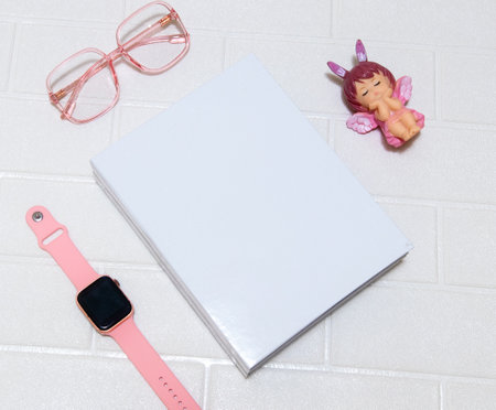 A couple of stacked white colored hardcover book laying out on the top of a white colored brick mat, hardcover mockup template imageの写真素材