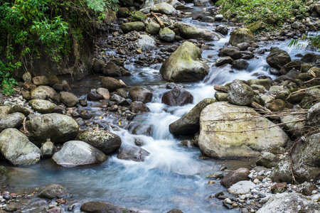 Discovering the Beauty of Nature: Slow Shutter Speed Pictures of Water and Rocks in Motionの写真素材