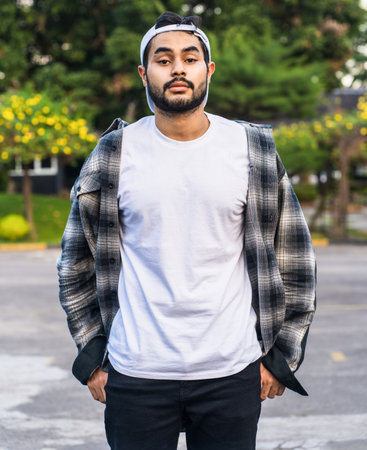 The clean and classic lines of the white blank shirt worn by this bearded man create a timeless and sophisticated look, perfect for any occasion, white blank shirt mockup imageの写真素材