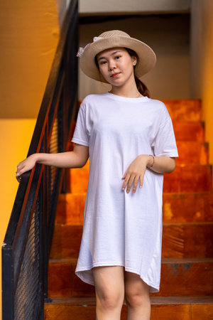 Portrait photography of a beautiful Asian woman in a serene setting, shirt dress mockup template imageの写真素材