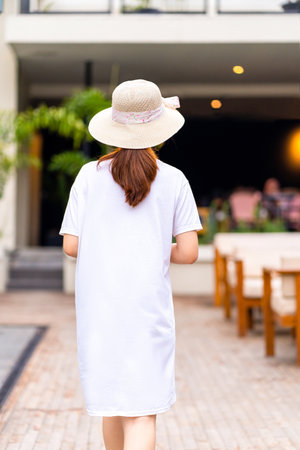 Beautiful Asian woman poses for a striking portrait in a scenic location, shirt dress mockup template imageの写真素材