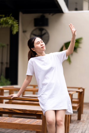 Portrait photography of a beautiful Asian woman in a serene environment, shirt dress mockup template imageの写真素材
