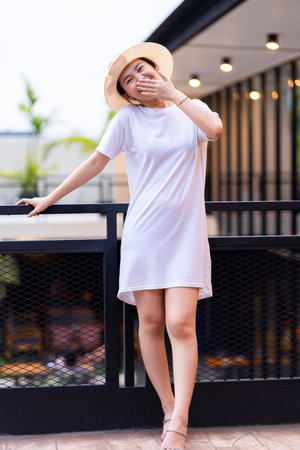 A captivating Asian woman captured in the perfect pose for portrait photography, shirt dress mockup template imageの写真素材