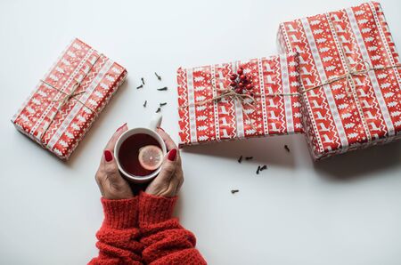 Female hands holding cup of teaの写真素材